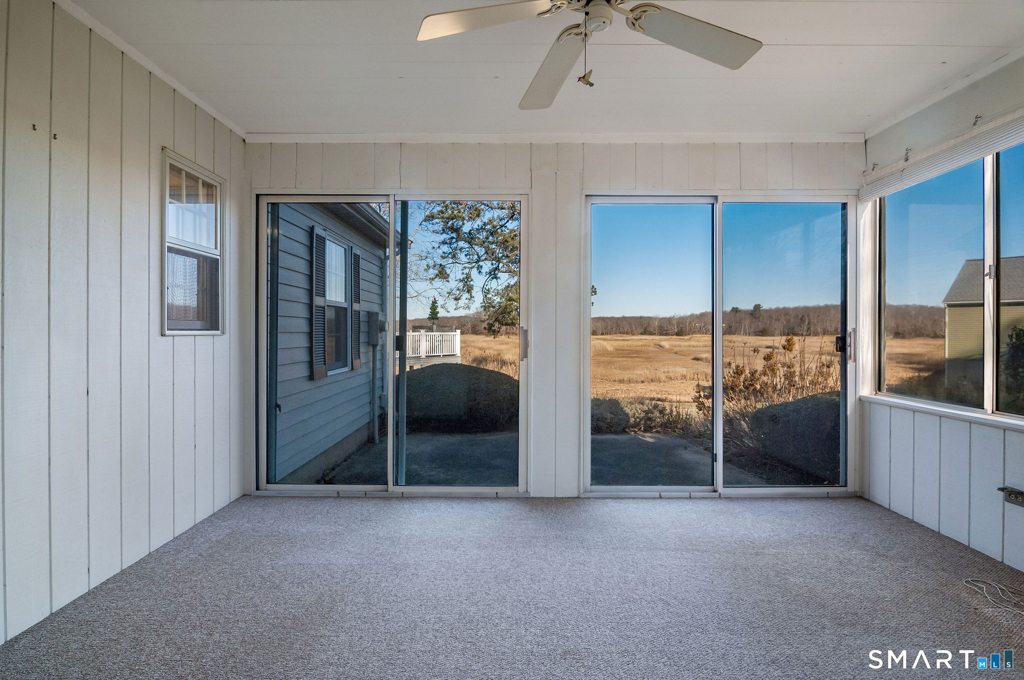 1 Downing Way, Unit 1 Madison, CT 06443 - Photo 16 of 26 a view of an empty room and window