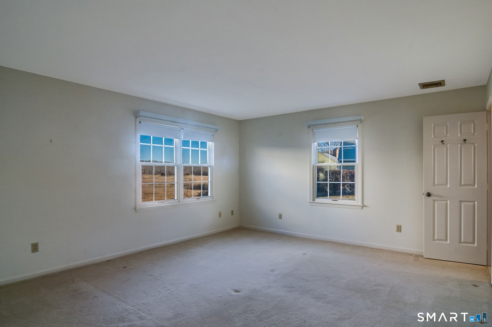 1 Downing Way, Unit 1 Madison, CT 06443 - Photo 17 of 26 an empty room with a window