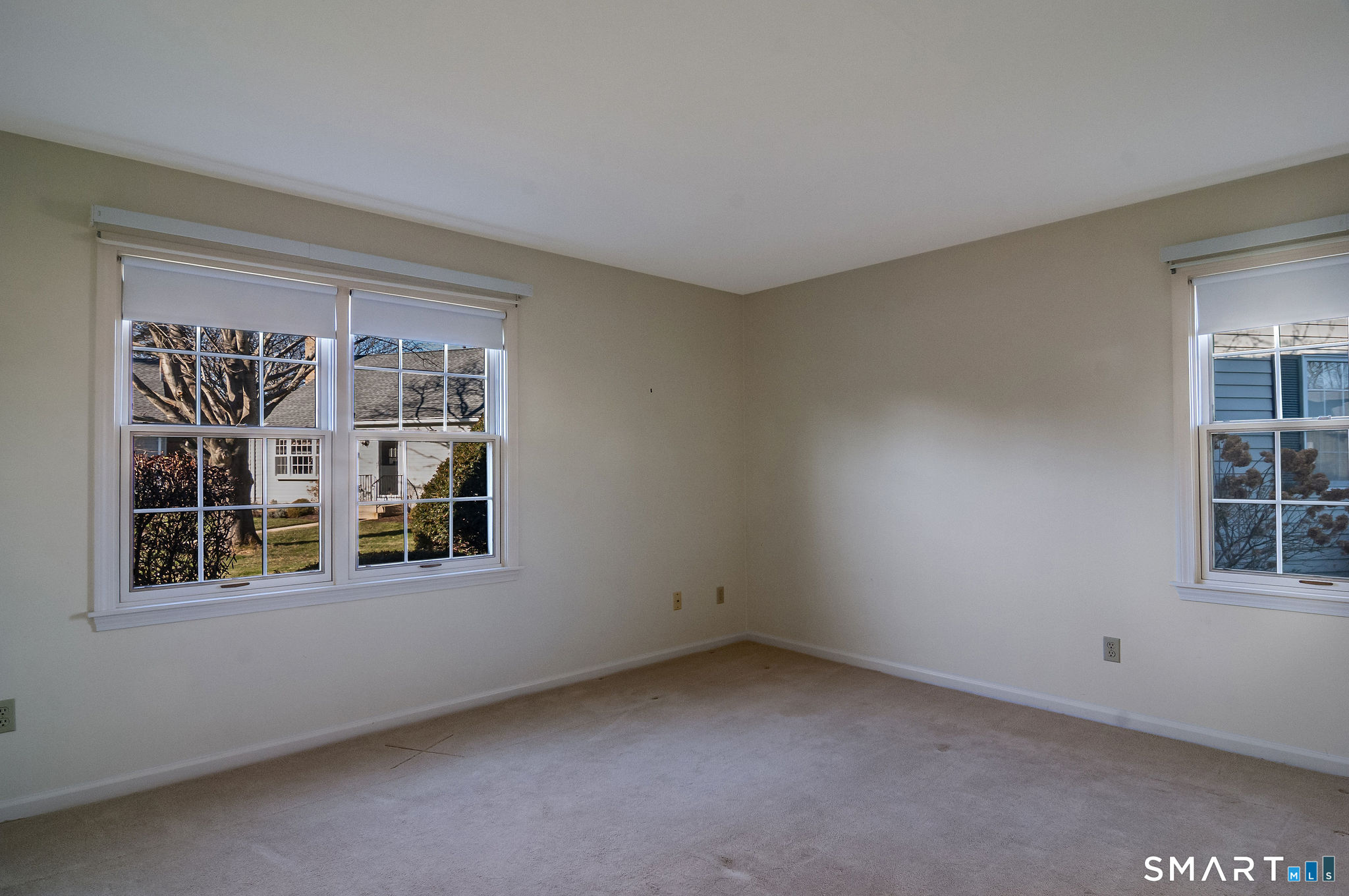 1 Downing Way, Unit 1 Madison, CT 06443 - Photo 19 of 26 an empty room with windows