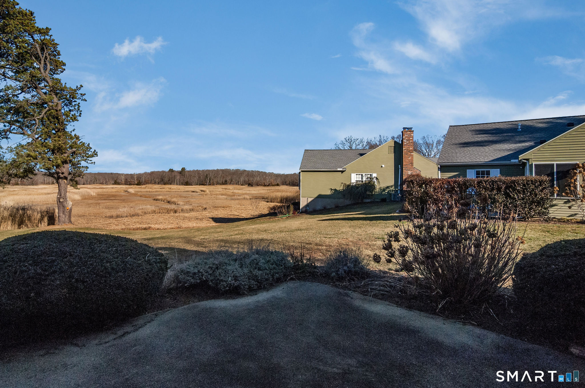 1 Downing Way, Unit 1 Madison, CT 06443 - Photo 23 of 26 a view of a lake with a car parked
