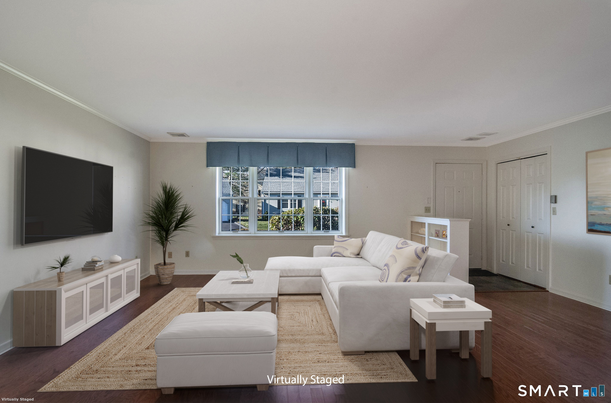 1 Downing Way, Unit 1 Madison, CT 06443 - Photo 6 of 26 a living room with furniture and a flat screen tv