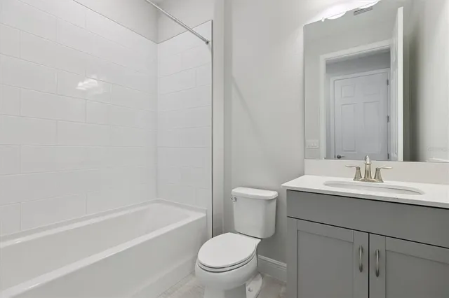 a bathroom with a toilet a sink and a bathtub