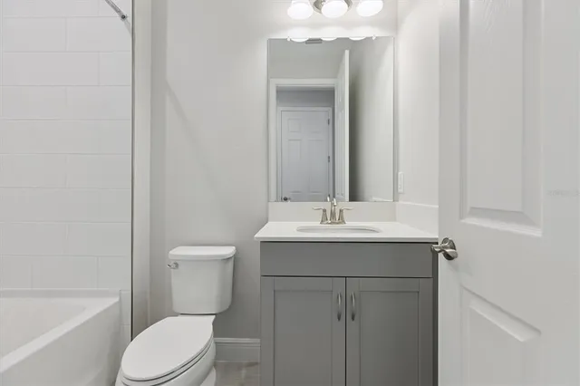 a bathroom with a toilet a sink and a bathtub