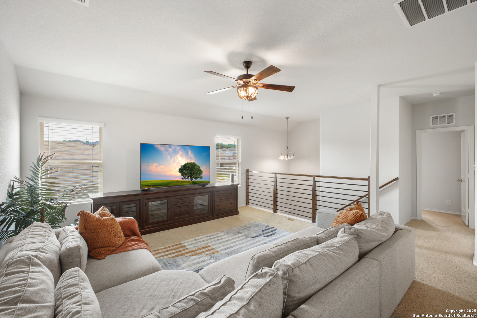 6908 Opus Lane Converse, TX 78109 - Photo 1 of 41 a bedroom with a bed and a chandelier