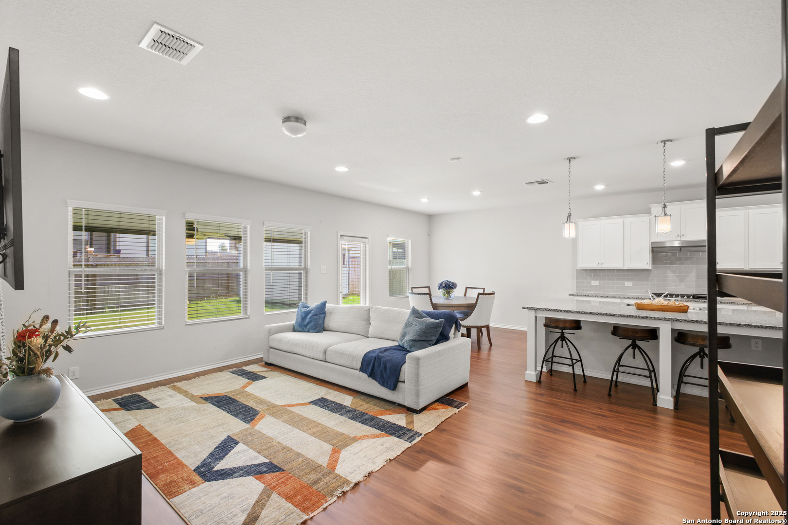 6908 Opus Lane Converse, TX 78109 - Photo 12 of 41 a living room with furniture wooden floor and a table