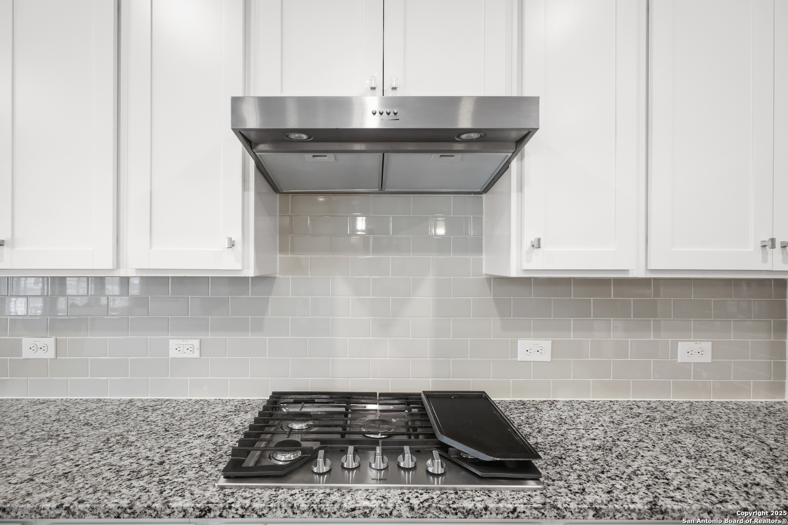 6908 Opus Lane Converse, TX 78109 - Photo 18 of 41 a kitchen with granite countertop a sink and cabinets