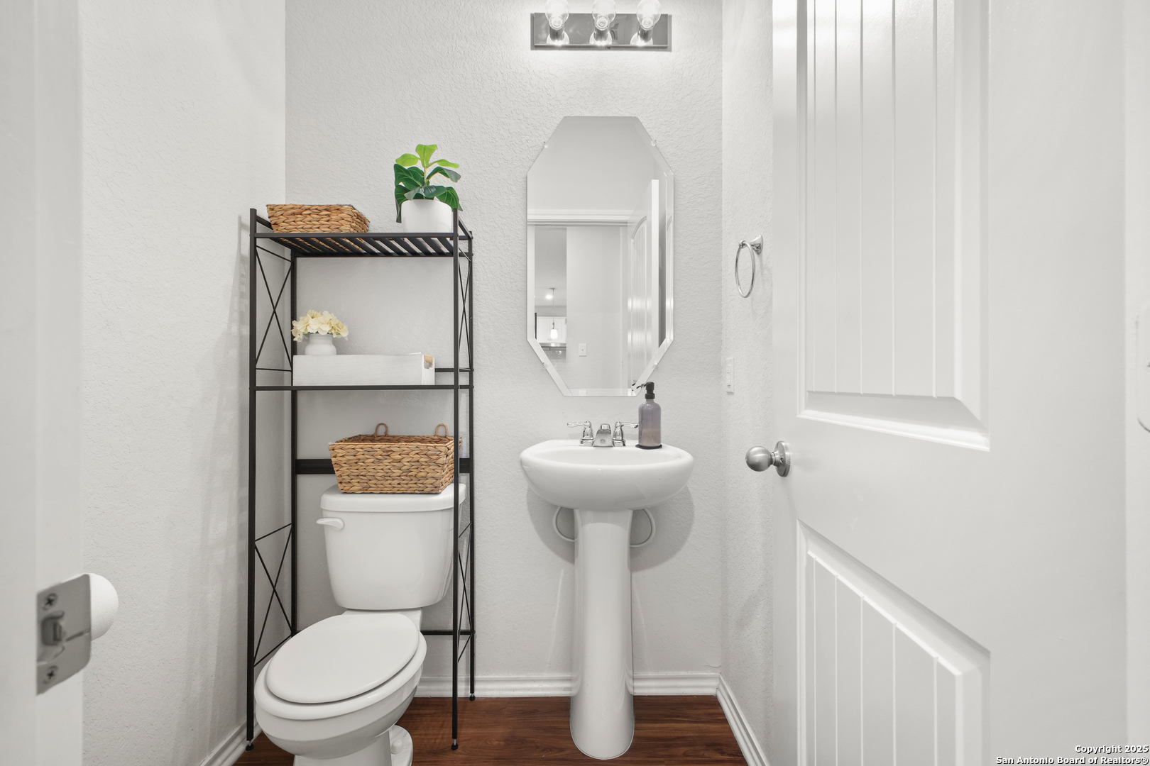 6908 Opus Lane Converse, TX 78109 - Photo 22 of 41 a bathroom with a toilet sink and mirror