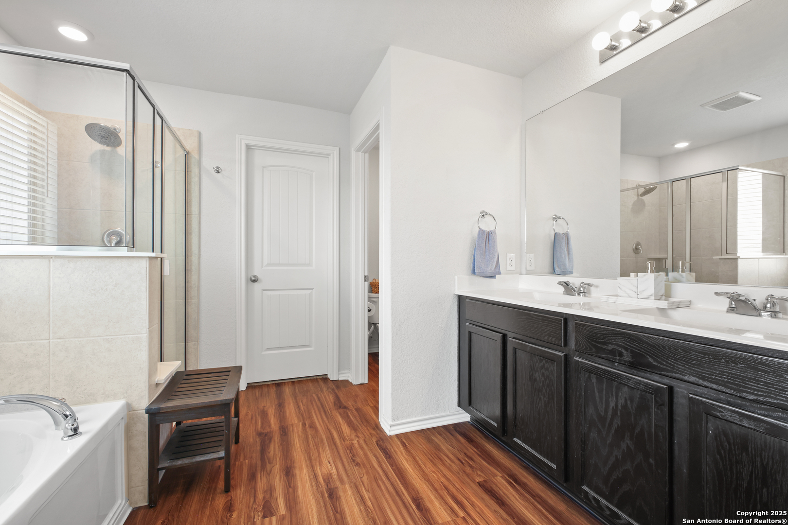 6908 Opus Lane Converse, TX 78109 - Photo 27 of 41 a view of a bathroom sink and a mirror