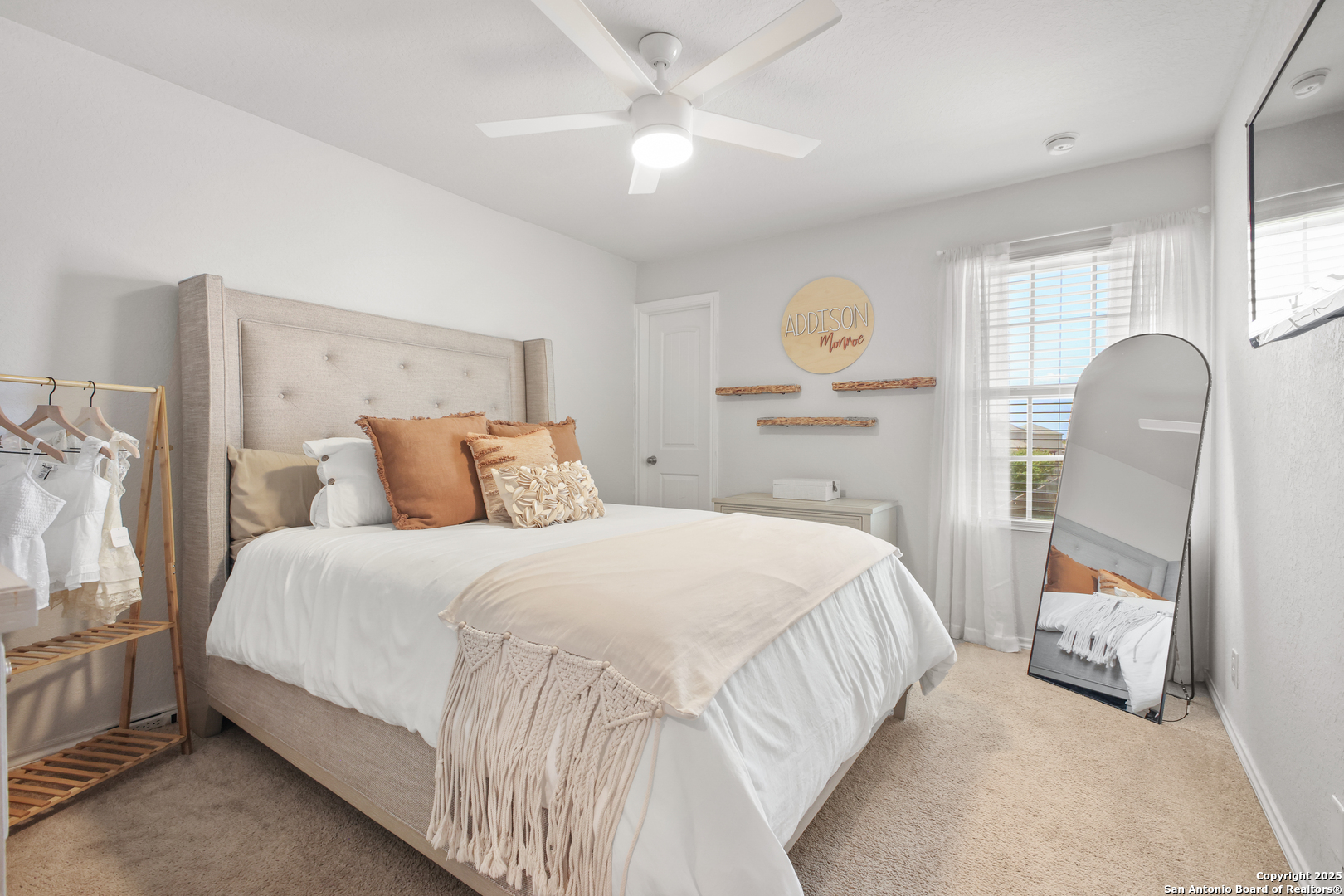 6908 Opus Lane Converse, TX 78109 - Photo 32 of 41 a bedroom with bed and window