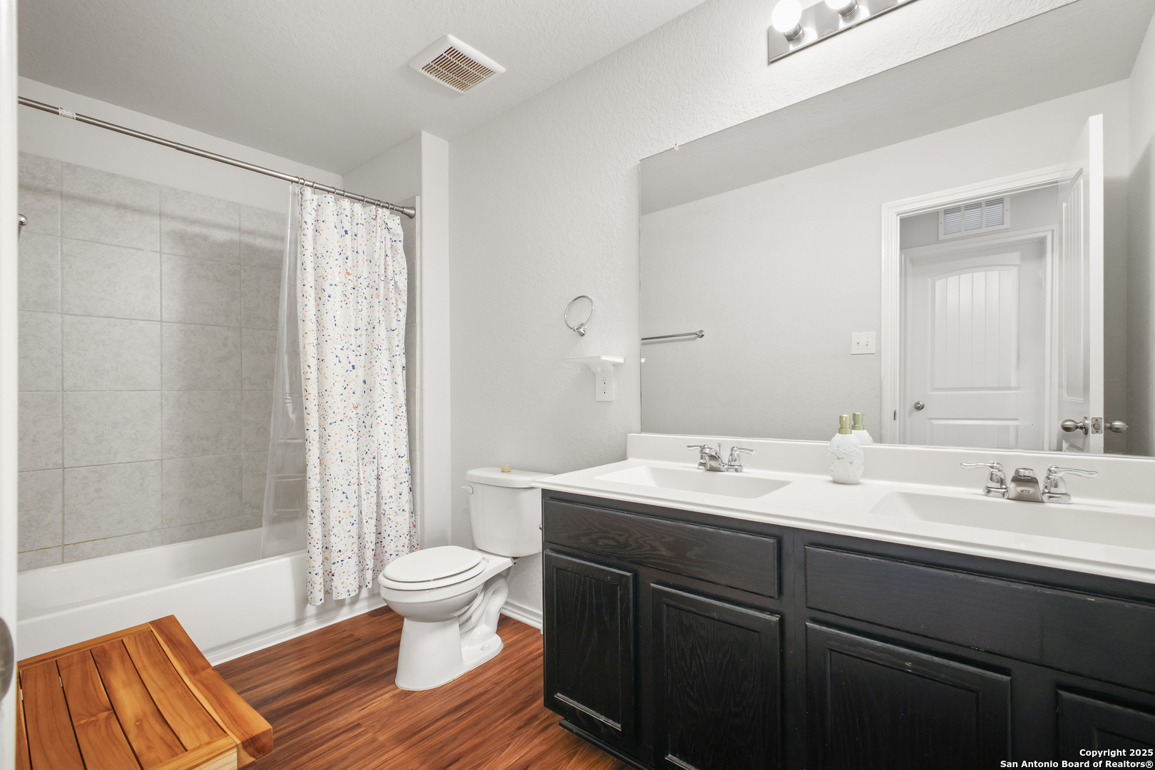 6908 Opus Lane Converse, TX 78109 - Photo 33 of 41 a bathroom with a sink and a mirror