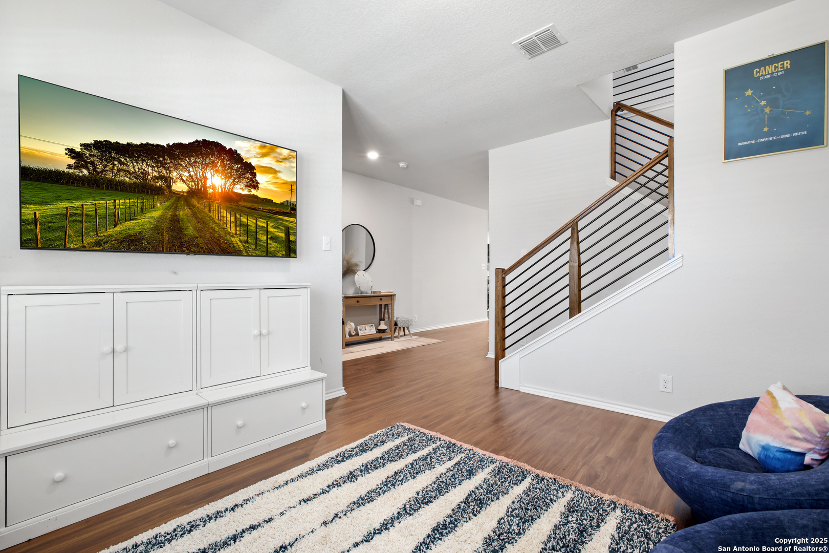 6908 Opus Lane Converse, TX 78109 - Photo 9 of 41 a living room with furniture and a flat screen tv