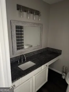 a close view of a sink a counter and utility room