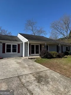 front view of a house with a yard