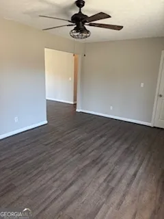 a view of a room with wooden floor