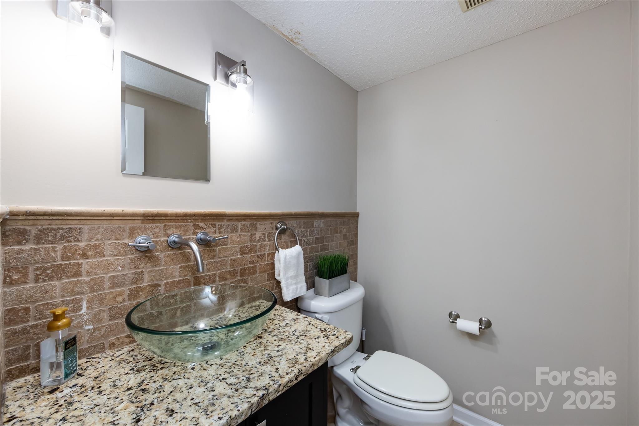 5013 Cedar Forest Drive Charlotte, NC 28226 - Photo 13 of 46 a bathroom with a granite countertop toilet and a mirror