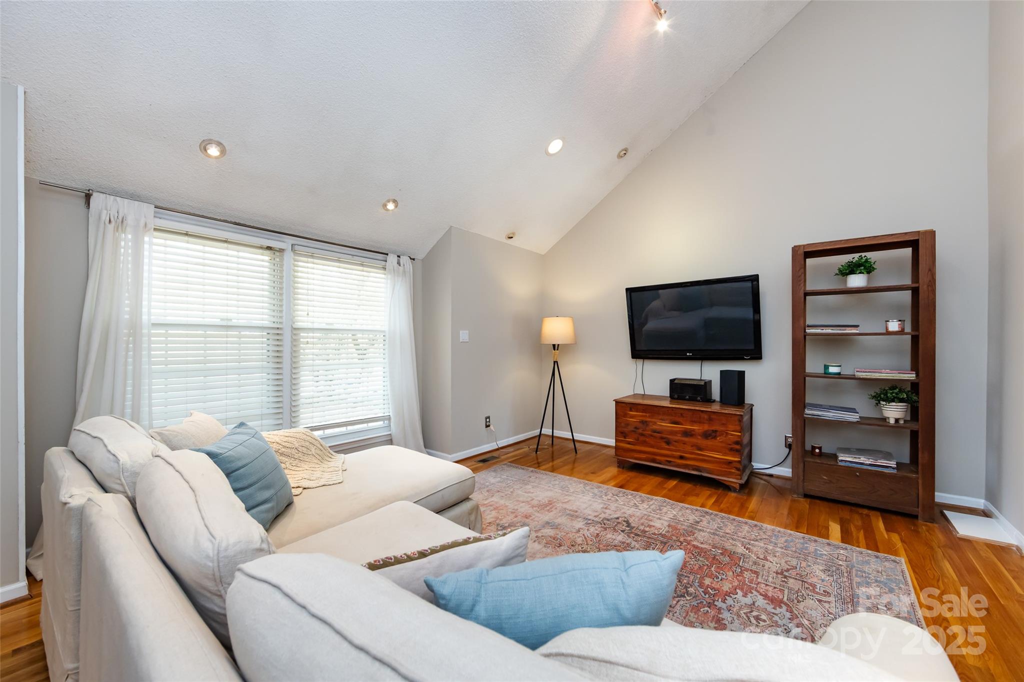 5013 Cedar Forest Drive Charlotte, NC 28226 - Photo 15 of 46 a living room with furniture and a flat screen tv