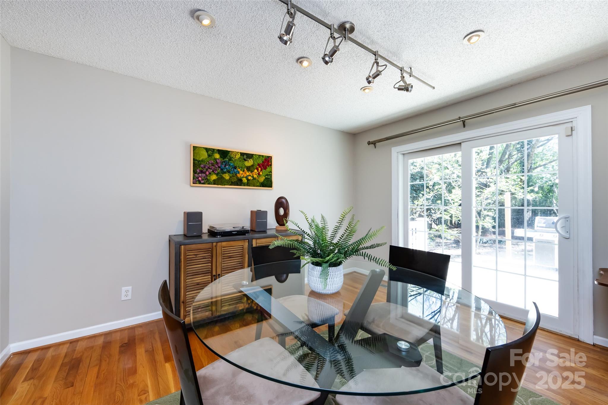 5013 Cedar Forest Drive Charlotte, NC 28226 - Photo 18 of 46 a workspace with furniture window and wooden floor
