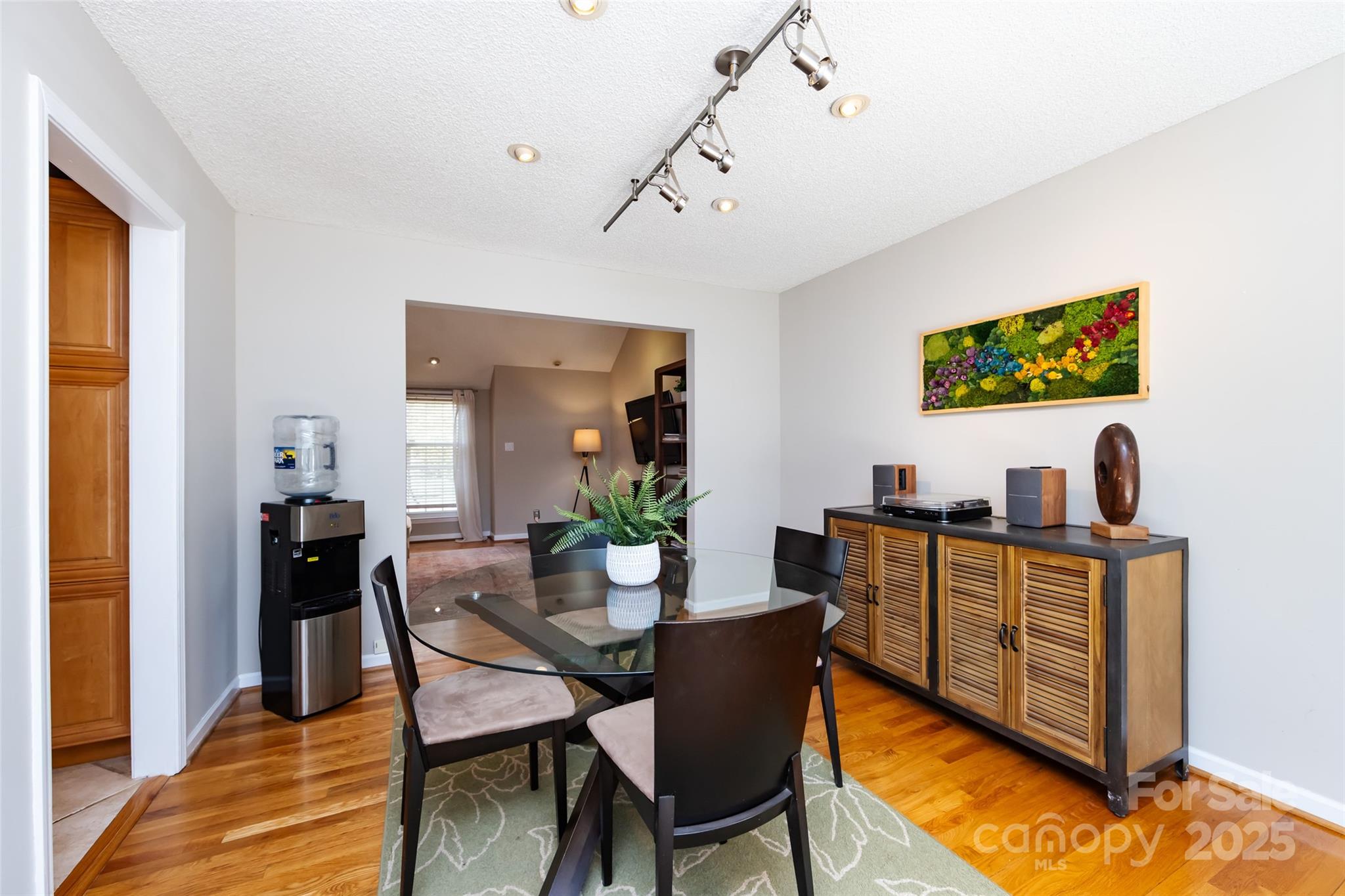 5013 Cedar Forest Drive Charlotte, NC 28226 - Photo 19 of 46 a view of a dining room with furniture and wooden floor