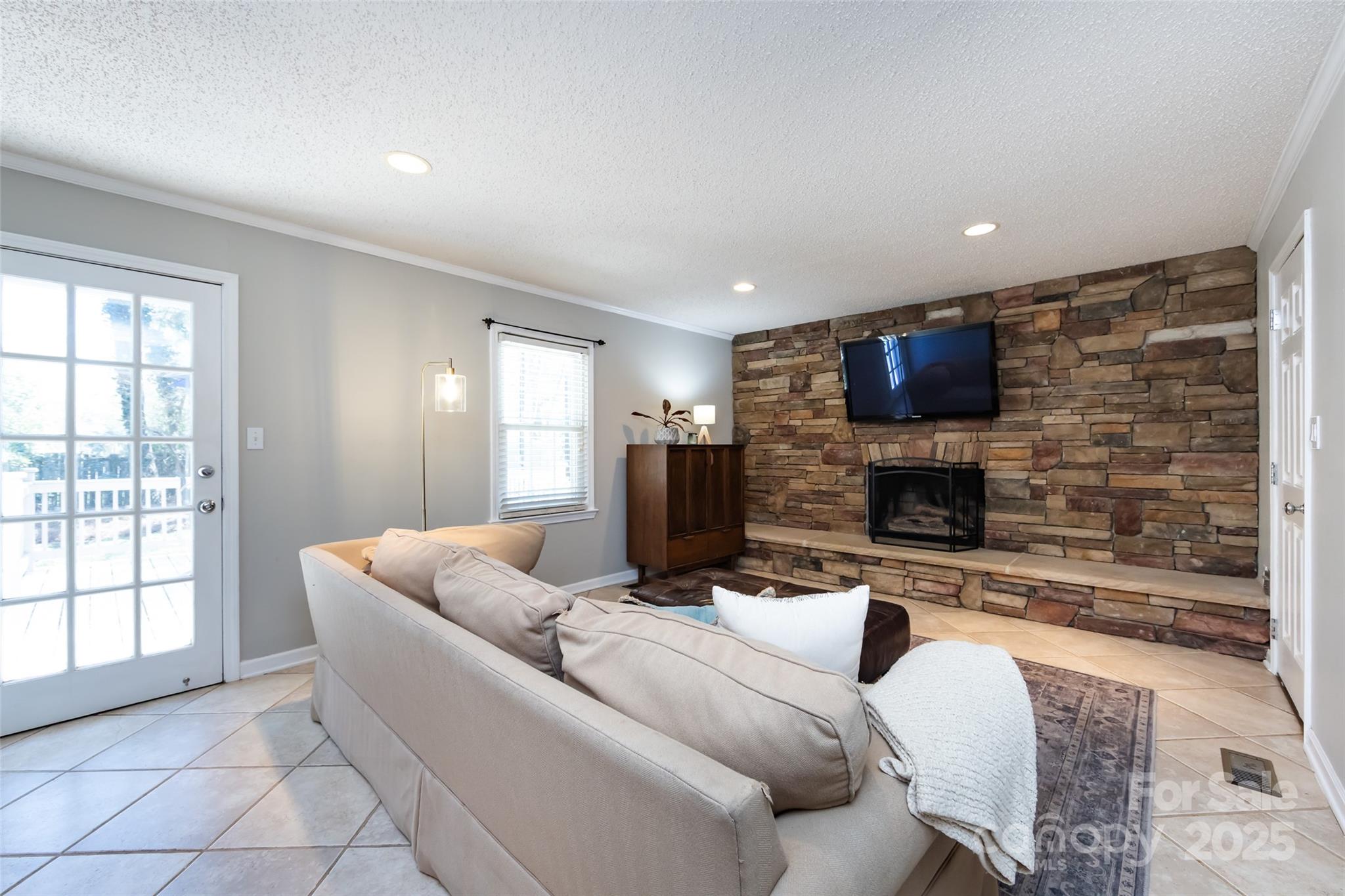 5013 Cedar Forest Drive Charlotte, NC 28226 - Photo 25 of 46 a living room with furniture and a flat screen tv