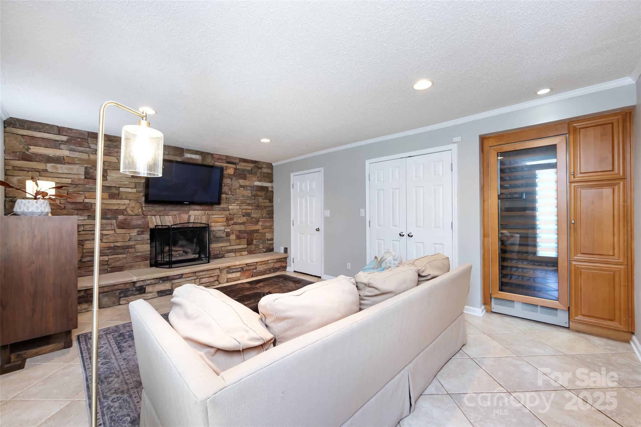 5013 Cedar Forest Drive Charlotte, NC 28226 - Photo 26 of 46 a living room with furniture a fireplace and a flat screen tv