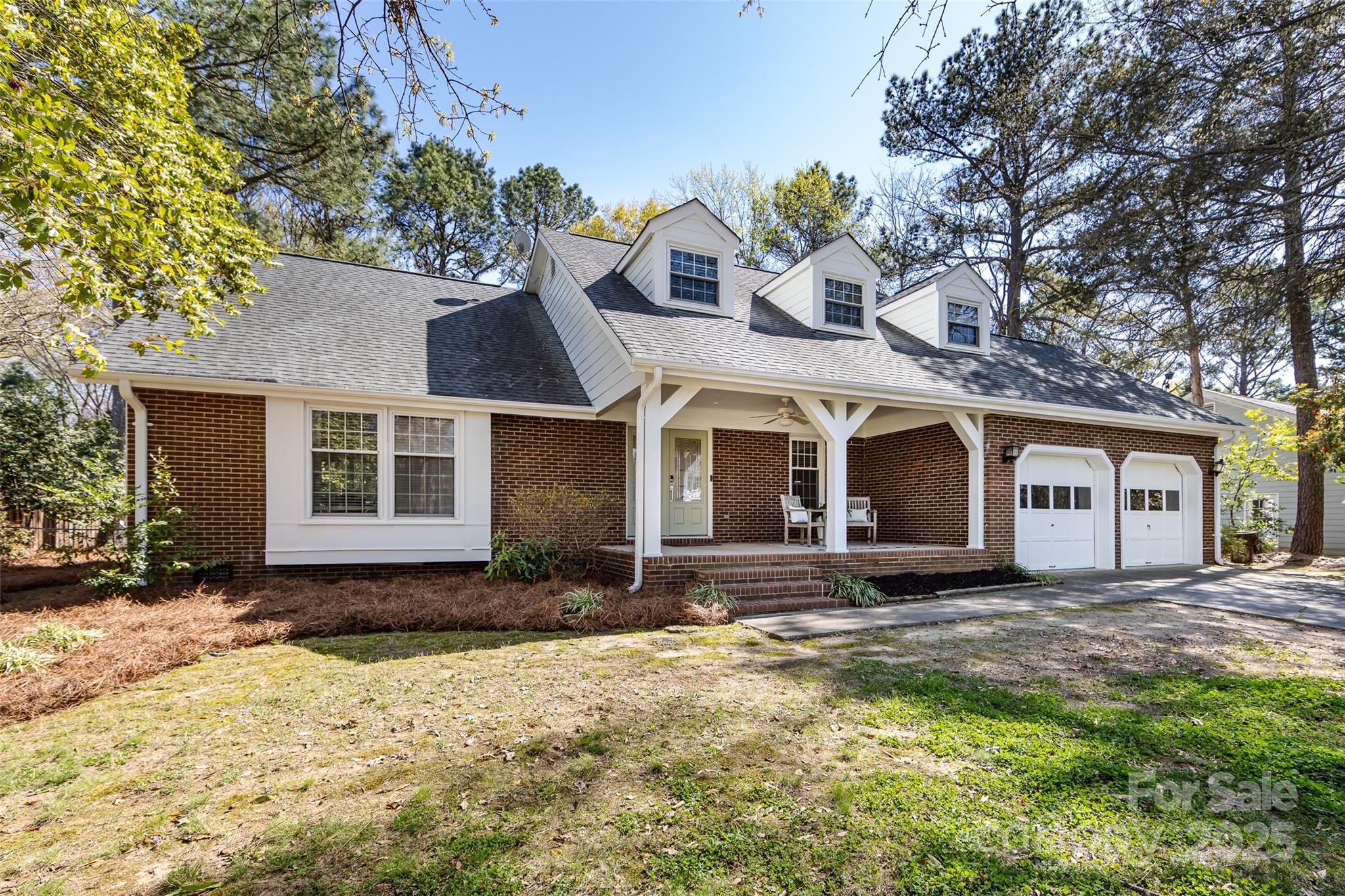 5013 Cedar Forest Drive Charlotte, NC 28226 - Photo 3 of 46 a front view of a house with a yard
