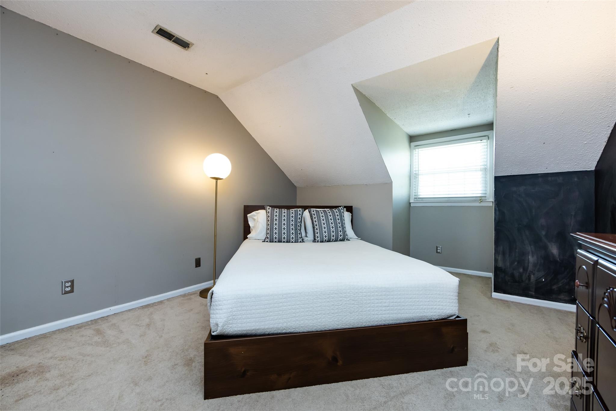 5013 Cedar Forest Drive Charlotte, NC 28226 - Photo 35 of 46 a bedroom with a bed and a television