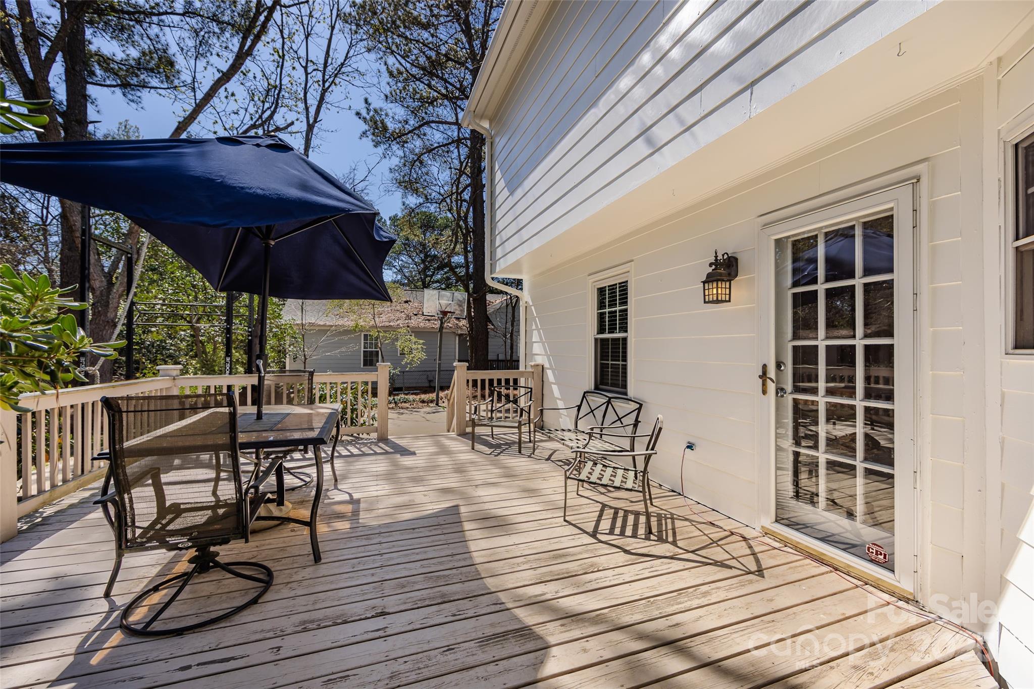 5013 Cedar Forest Drive Charlotte, NC 28226 - Photo 42 of 46 a view of patio with table and chairs under an umbrella with wooden floor and fence