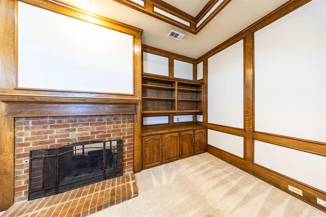 a kitchen view with wooden floor and a fireplace