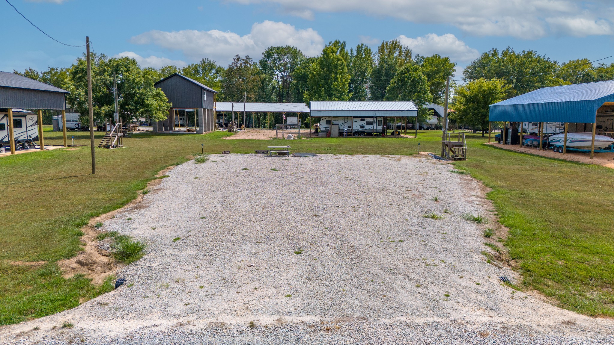 1020 WC PICKETT Road Clifton, TN 38425 - Photo 11 of 25 a view of a swimming pool with a house in the background