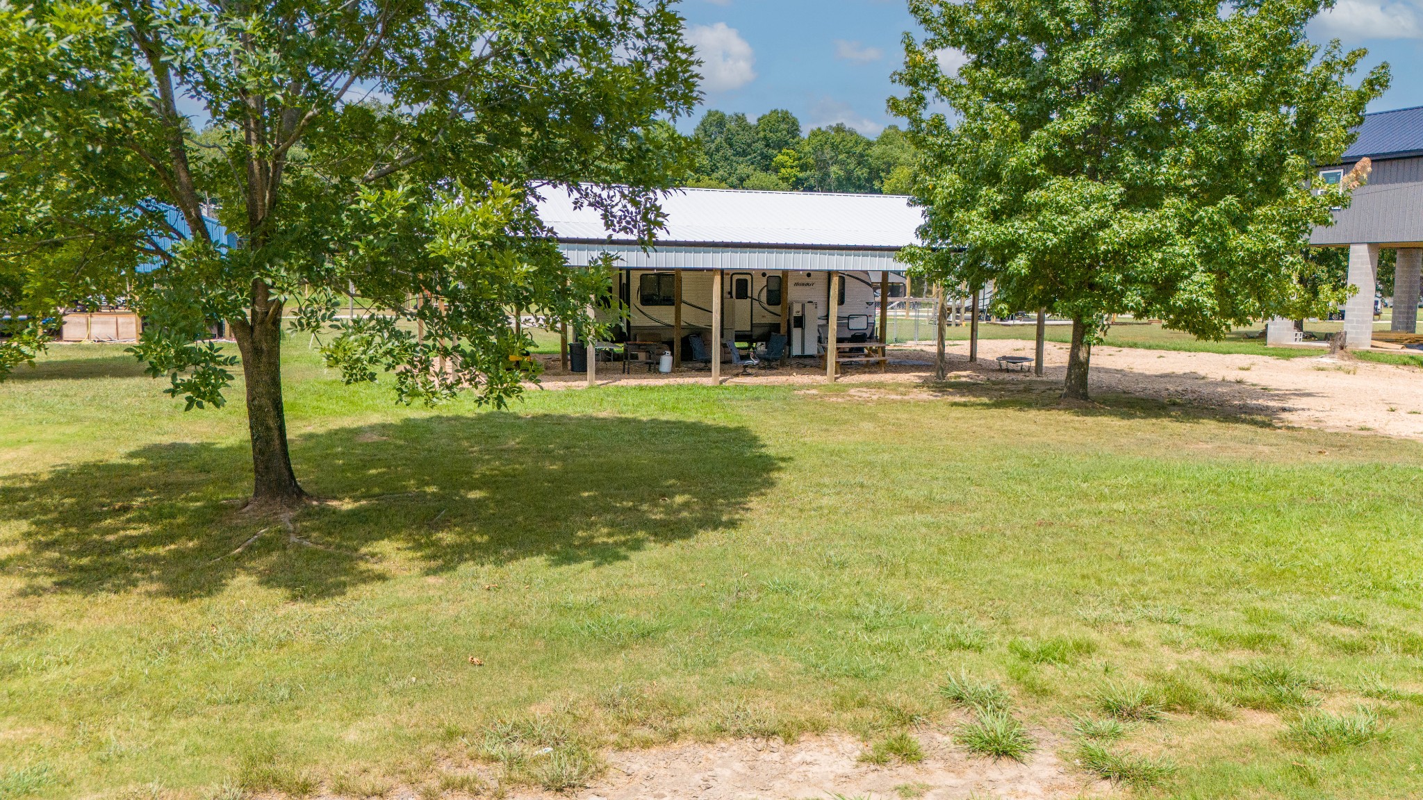 1020 WC PICKETT Road Clifton, TN 38425 - Photo 15 of 25 a front view of a house with a yard