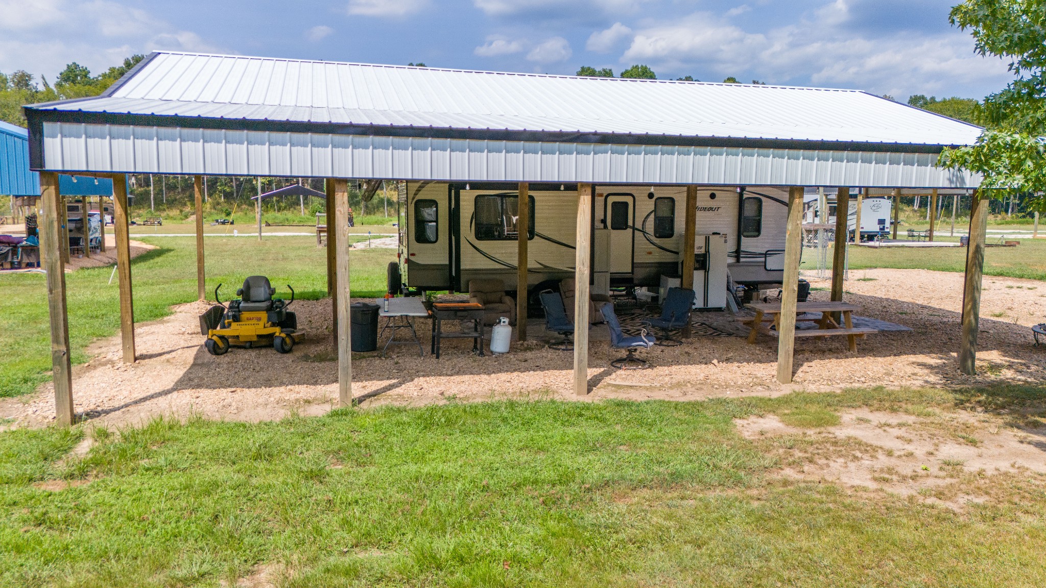 1020 WC PICKETT Road Clifton, TN 38425 - Photo 16 of 25 a view of a house with a backyard patio and balcony