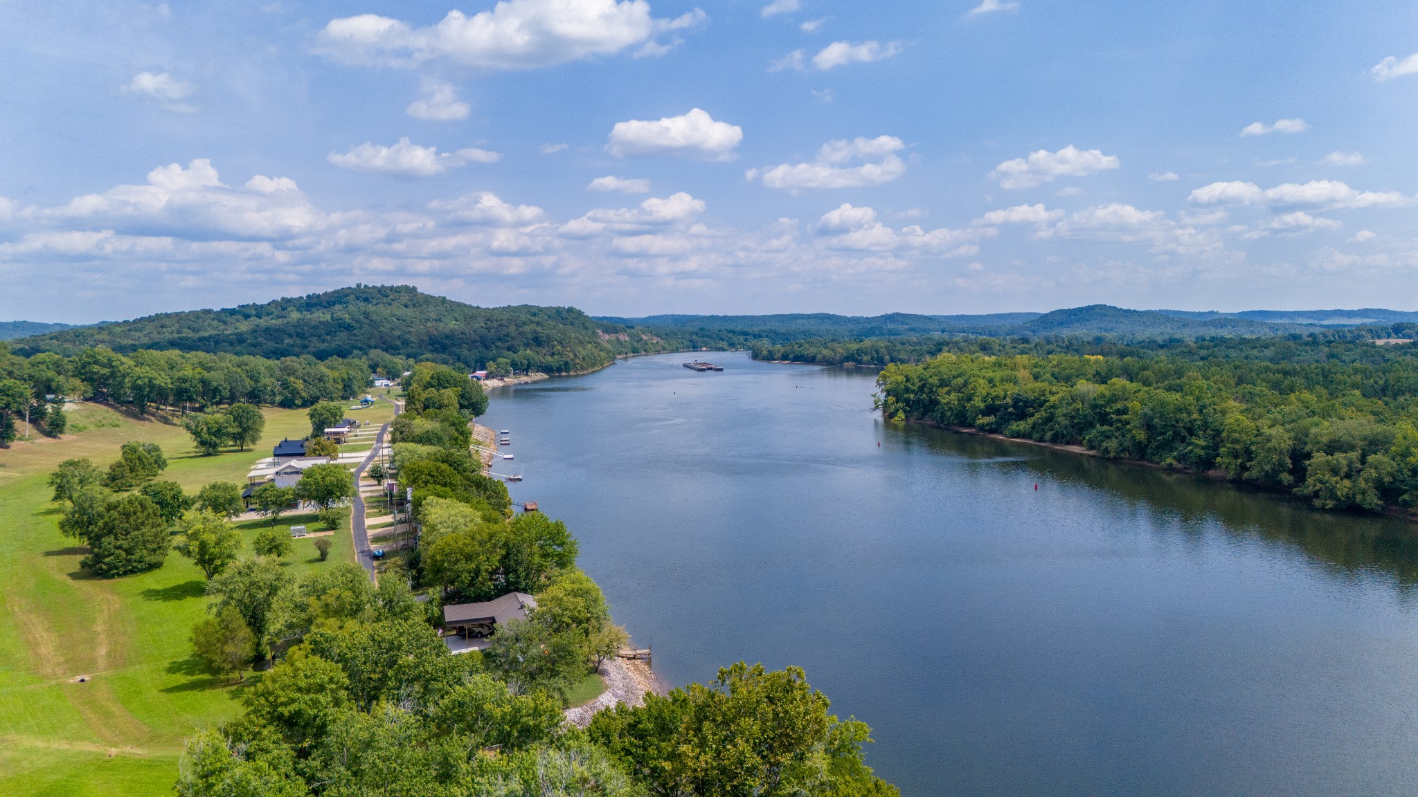 1020 WC PICKETT Road Clifton, TN 38425 - Photo 20 of 25 a view of a lake with a city