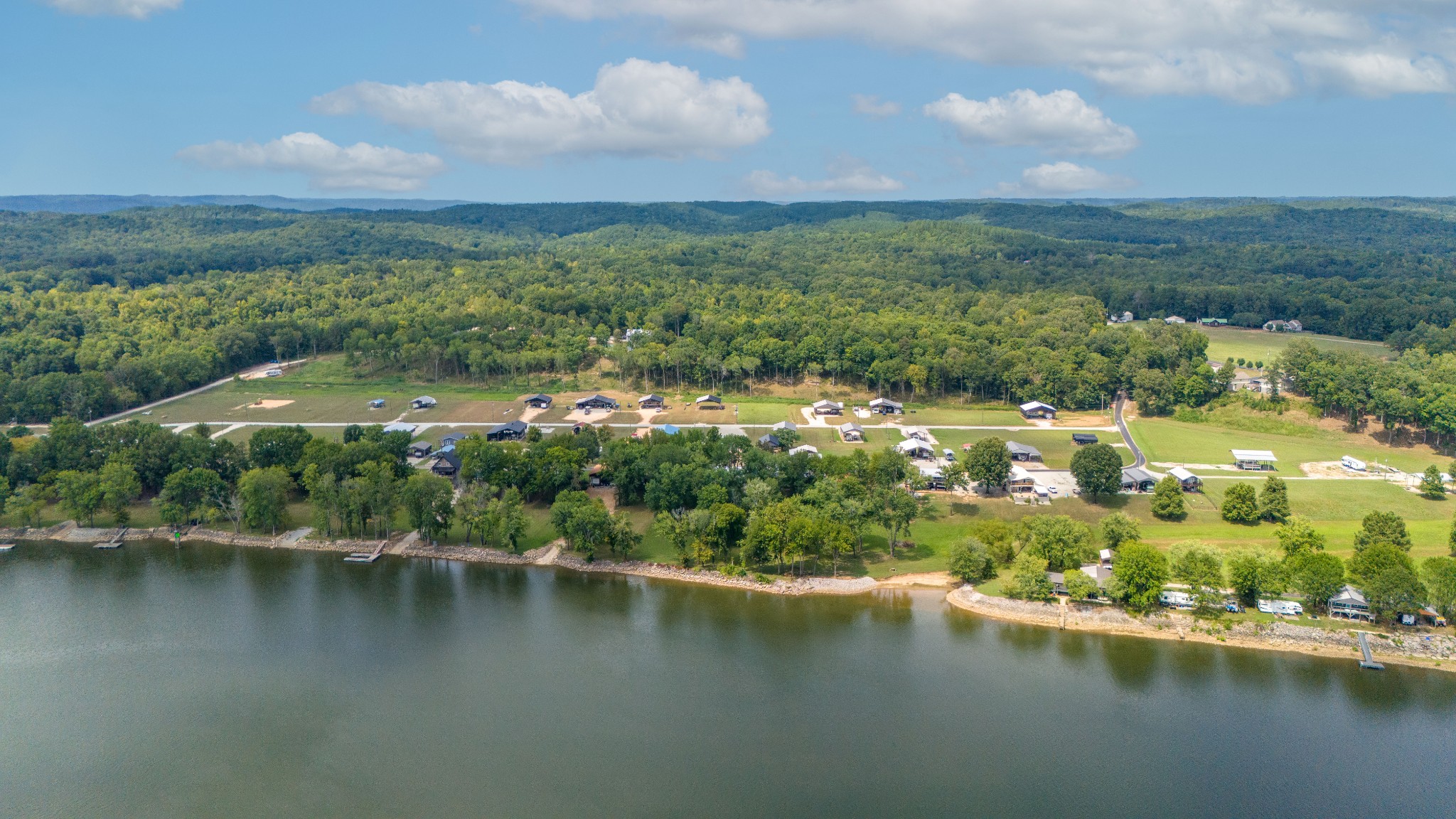 1020 WC PICKETT Road Clifton, TN 38425 - Photo 22 of 25 an aerial view of residential houses with outdoor space and lake view