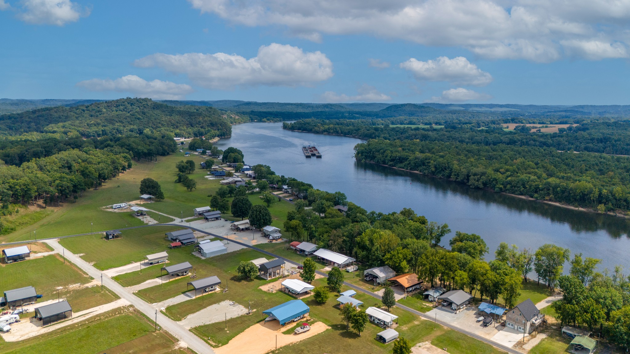 1020 WC PICKETT Road Clifton, TN 38425 - Photo 25 of 25 an aerial view of a residential houses with outdoor space and trees all around