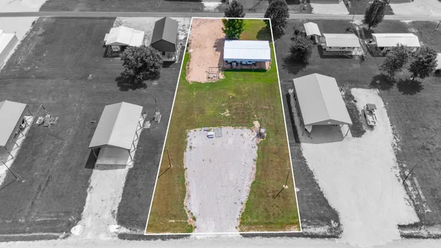 an aerial view of a house with swimming pool