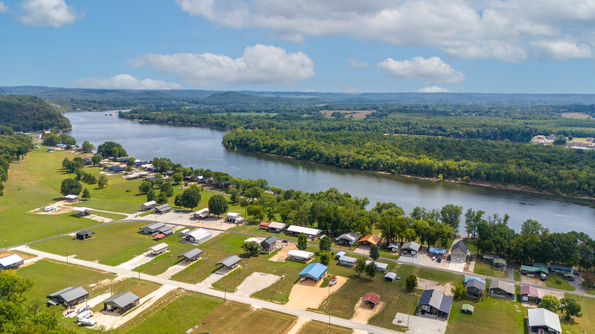 1020 WC PICKETT Road Clifton, TN 38425 - Photo 9 of 25 an aerial view of lake residential houses with outdoor space and lake view in back