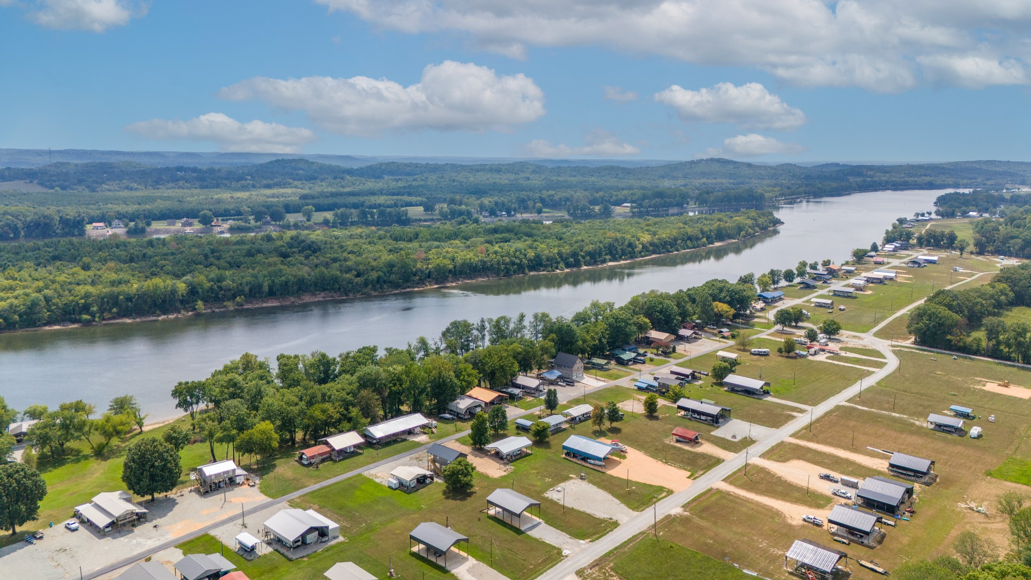 1020 WC PICKETT Road Clifton, TN 38425 - Photo 10 of 25 an aerial view of a city with lake view