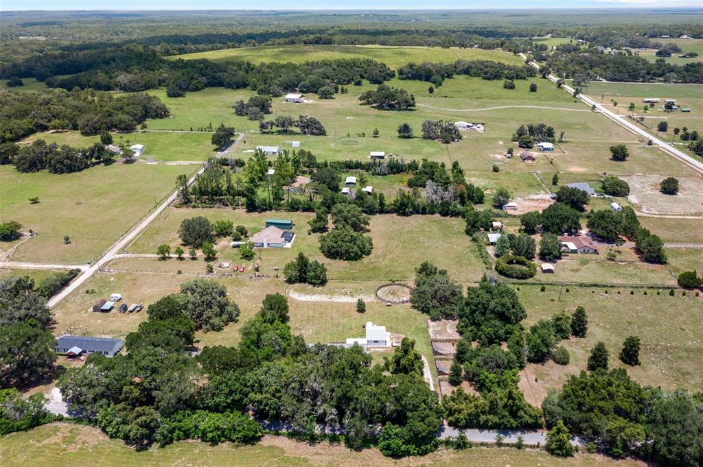 26255 Lambeth Road Brooksville, FL 34601 - Photo 67 of 76 an aerial view of residential houses with outdoor space