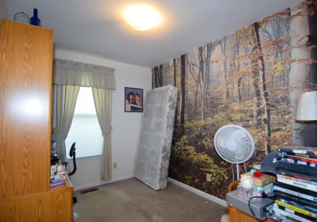 a bathroom with a sink toilet and a mirror
