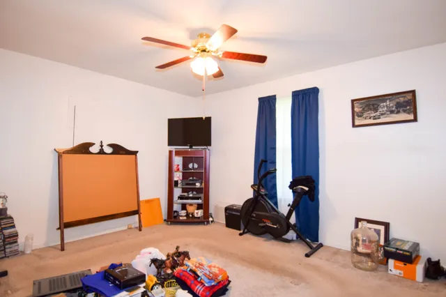 a room with furniture and a flat screen tv