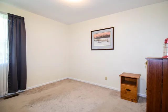 an empty room with a hallway