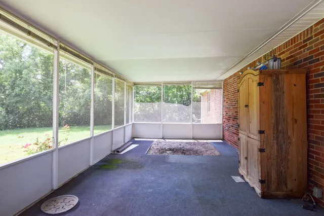 a view of an empty room and windows