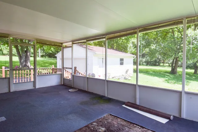 a view of an empty room with a large window