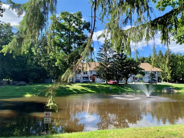 a view of a lake with a building in the background