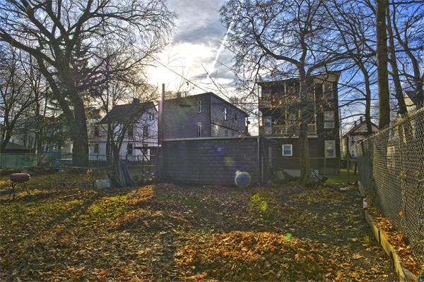 23 Crowell Street Boston, MA 02124 - Photo 11 of 11 a view of a house with a yard