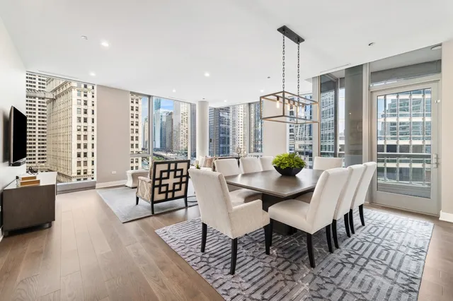 a living room with furniture a window and a table
