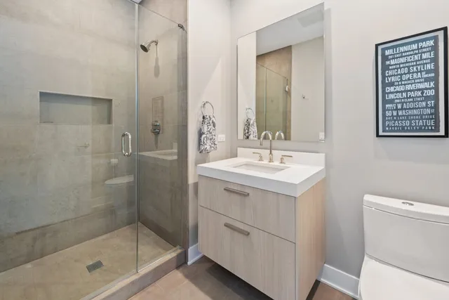 a bathroom with a shower sink and mirror