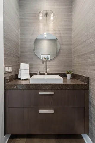 a bathroom with a sink and a mirror