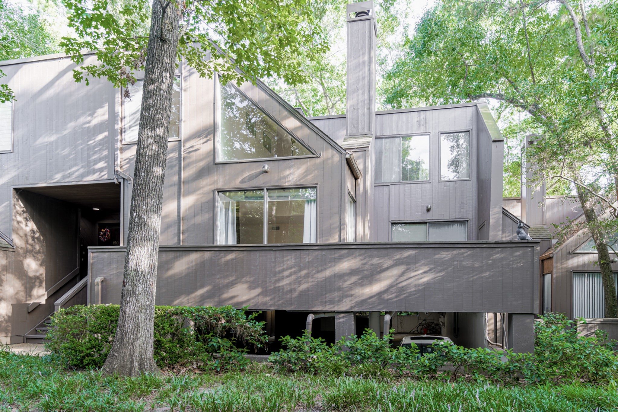 152 Litchfield Lane Houston, TX 77024 - Photo 2 of 33 aerial view of a house with a yard and large tree