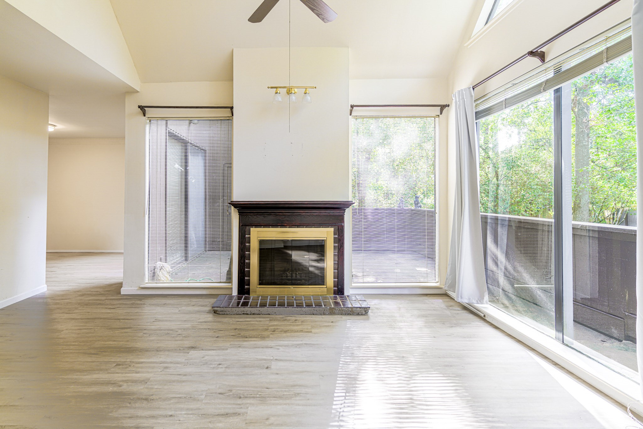 152 Litchfield Lane Houston, TX 77024 - Photo 7 of 33 a view of a livingroom with a fireplace and window